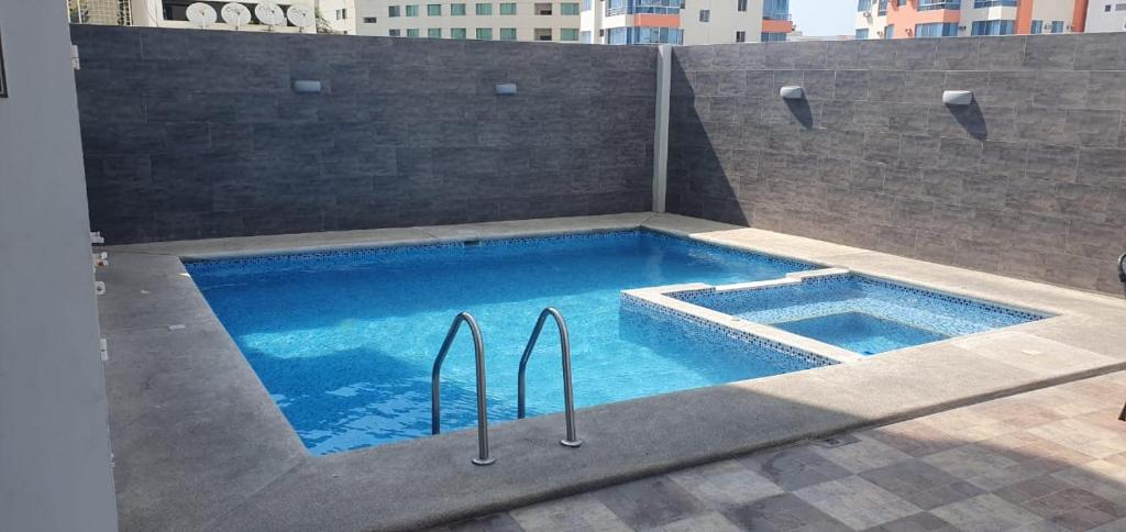 a swimming pool on top of a building at Jade Aparts Salinas in Salinas