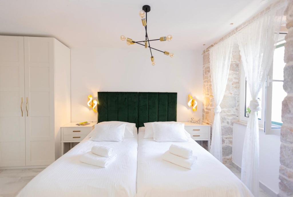 Postel nebo postele na pokoji v ubytování Guest House Paradise