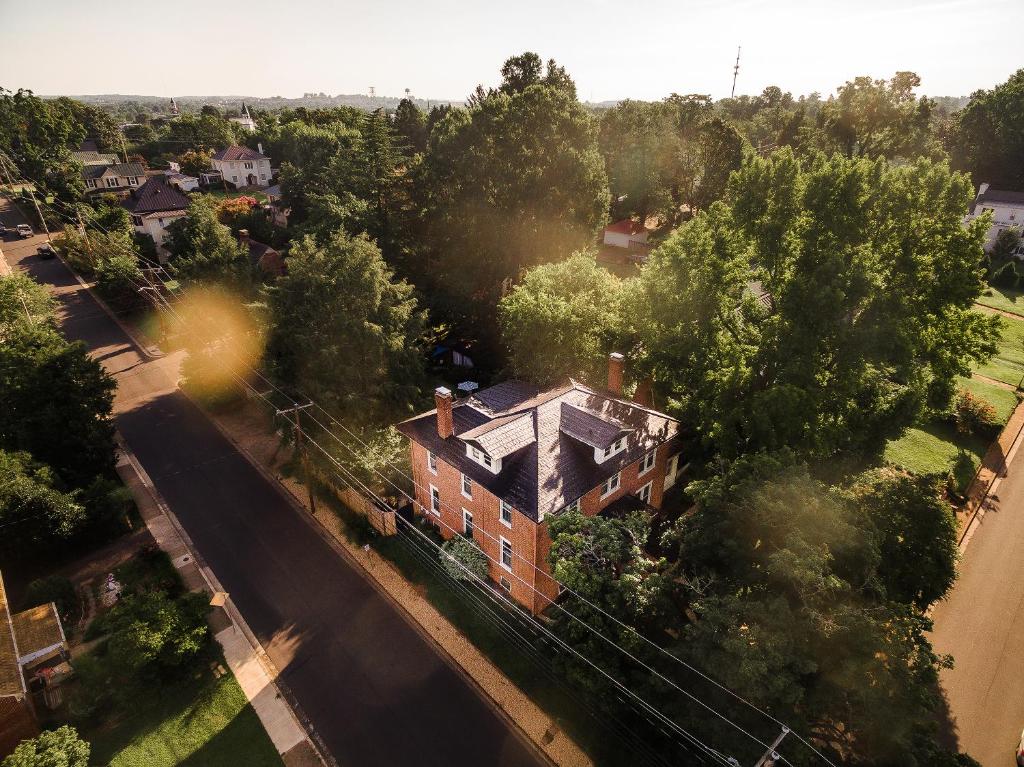 an overhead view of a house with a road and trees at West Park Gardens in Culpeper