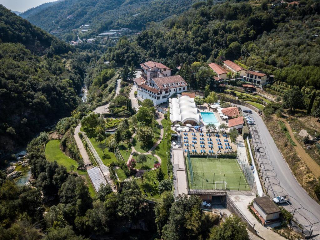 an aerial view of a resort in the mountains at Hotel Lago Bin in Rocchetta Nervina