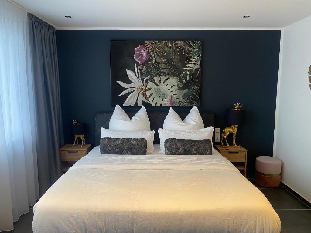 Postel nebo postele na pokoji v ubytování MARRAM Suitehotel