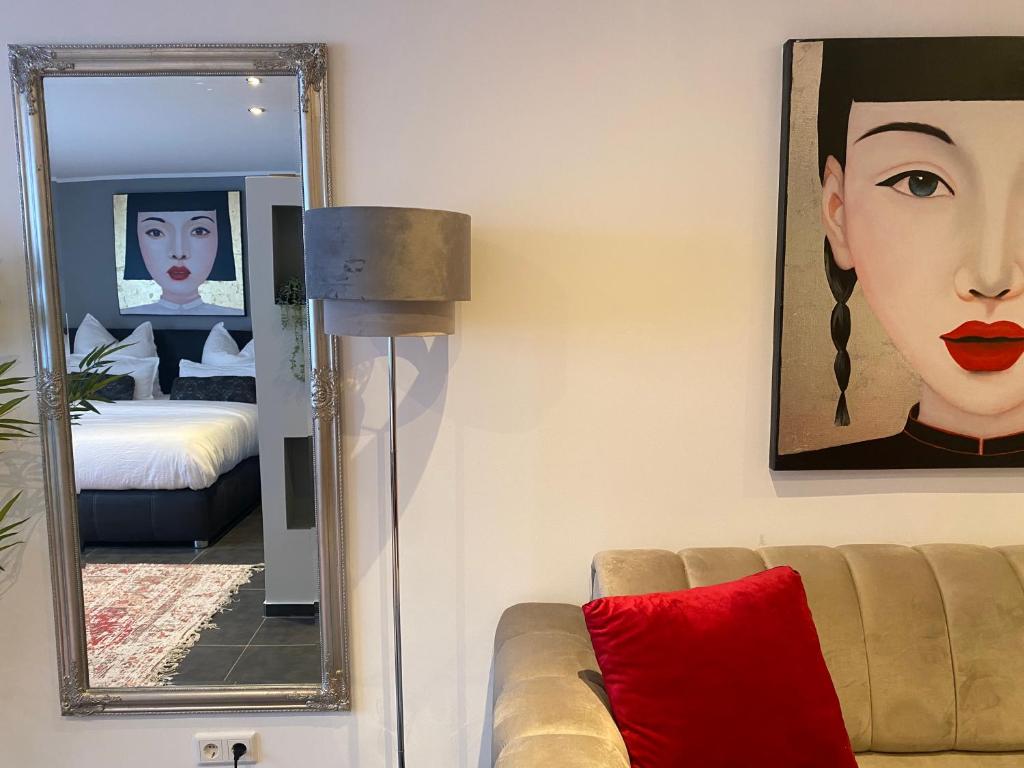Postel nebo postele na pokoji v ubytování MARRAM Suitehotel