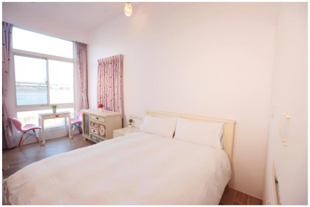 Postel nebo postele na pokoji v ubytování 兆億申襄采民宿1741 Zhao Yì Shen Xiang Cai Homestay 1741