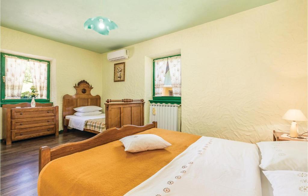 Posteľ alebo postele v izbe v ubytovaní Two-Bedroom Holiday Home In Otocac
