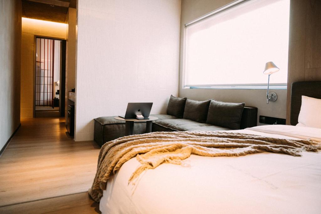 Postel nebo postele na pokoji v ubytování NOA Hotel XIAMEN