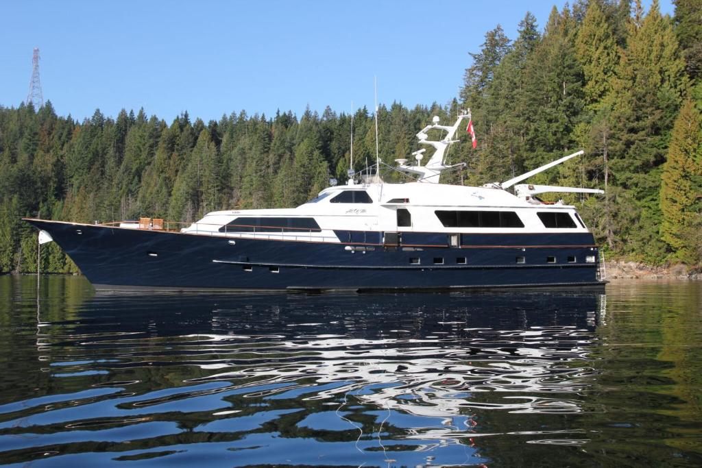 a boat sitting in the water on a lake at All Of Me Yacht in Richmond