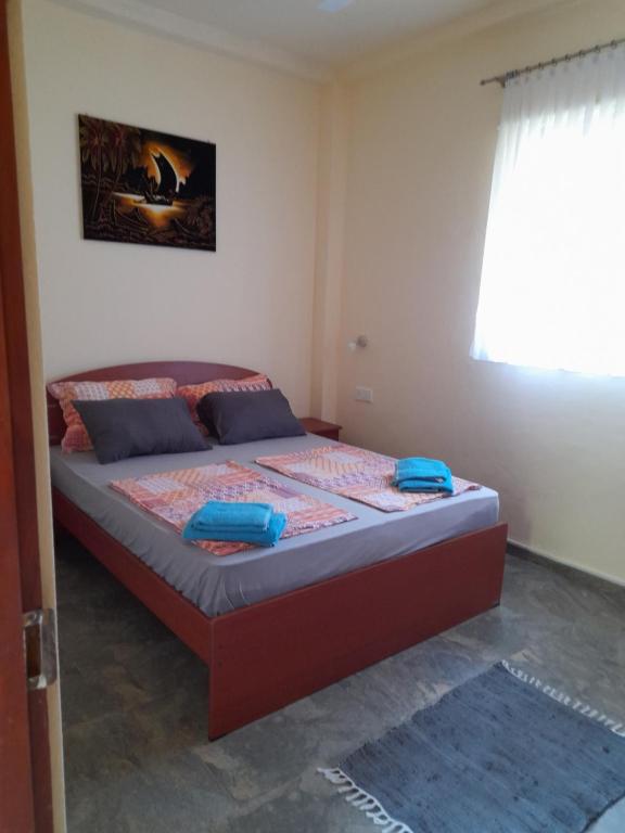 Postel nebo postele na pokoji v ubytování SLG Villa Hikkaduwa