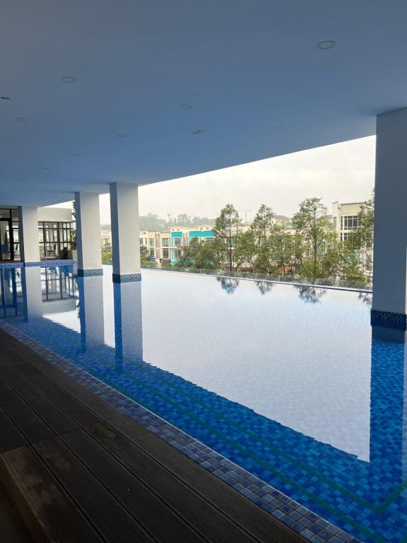 a view of a swimming pool in a building at TheSevenBahrin Homestay in Seri Kembangan
