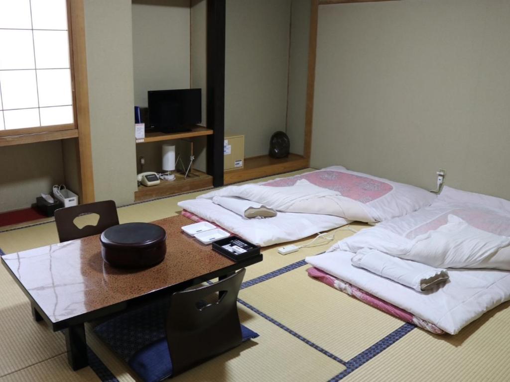 TV a/nebo společenská místnost v ubytování Hotel Suehiro
