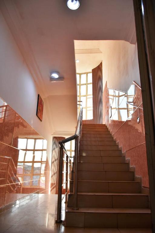 a staircase in a building with a stair case at World Class Hotel & Apartments in Abuja