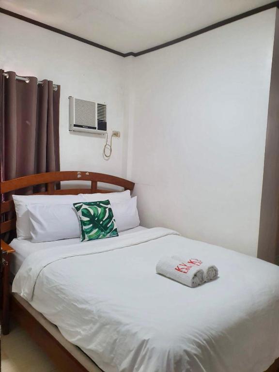 Postel nebo postele na pokoji v ubytování Kalis Viewpoint Lodge Coron