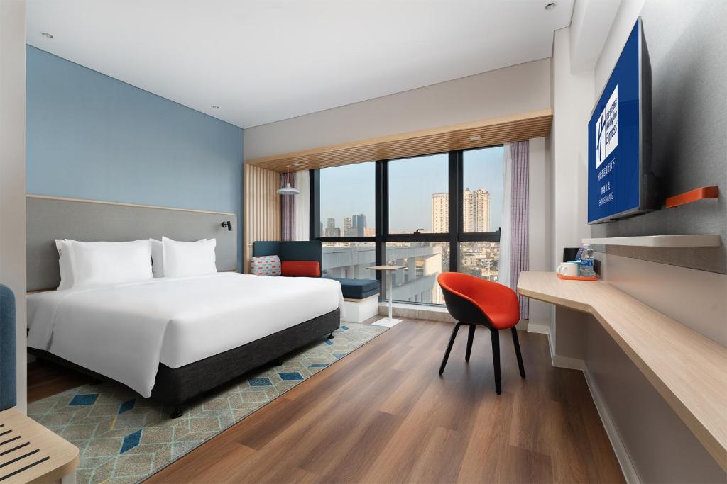 Postel nebo postele na pokoji v ubytování Holiday Inn Express Shunde Daliang by IHG