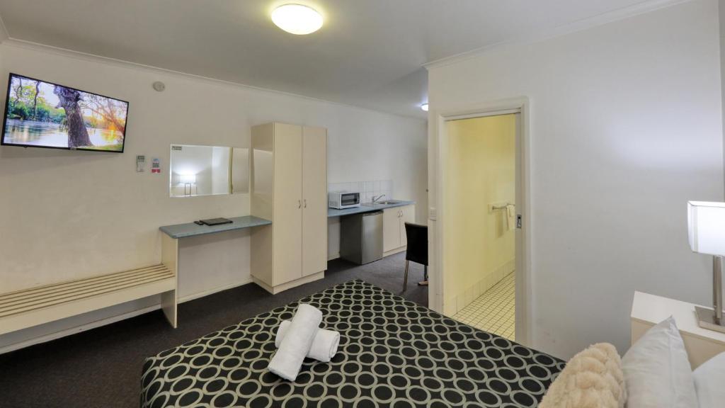 Kuchyň nebo kuchyňský kout v ubytování The Cottage Motor Inn Albury CBD