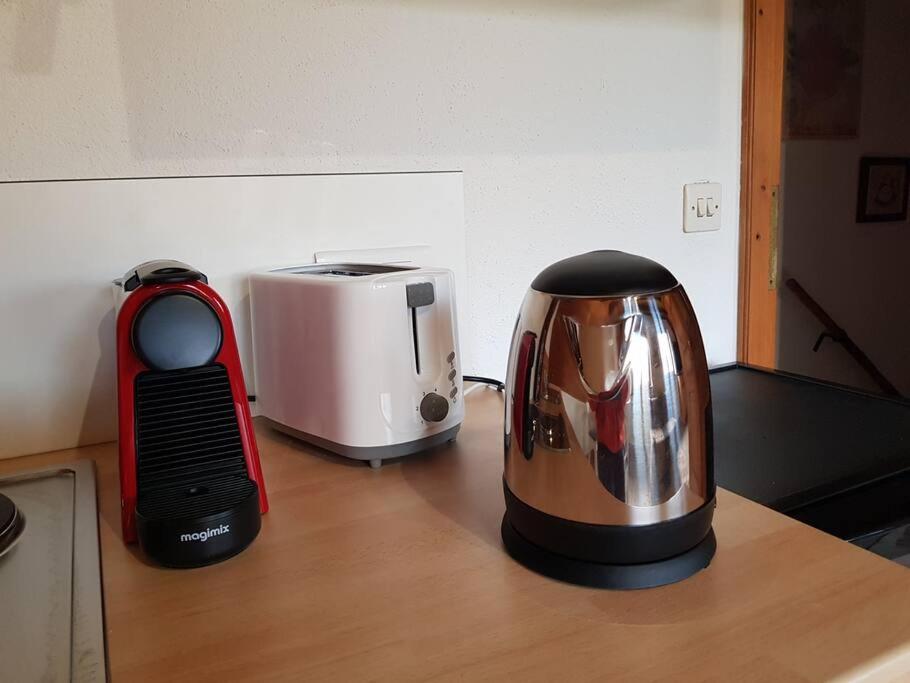 a coffee maker and a toaster sitting on a counter at Studio Marie-Rose in Ribeauvillé