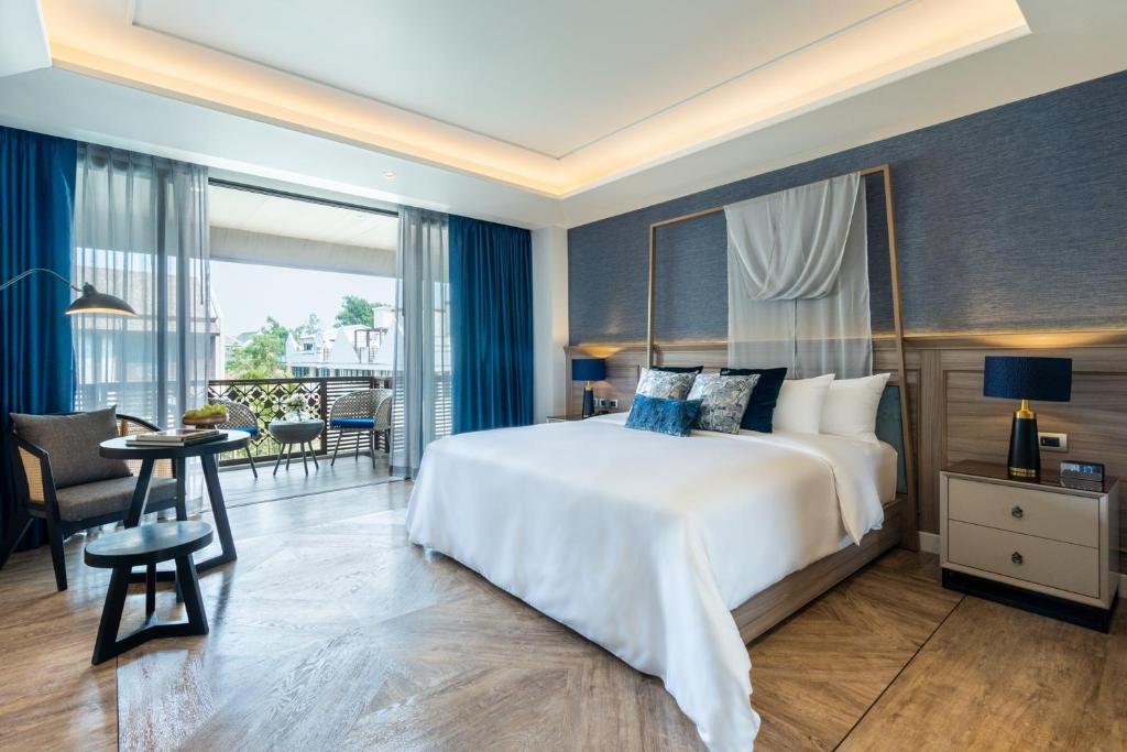 Postel nebo postele na pokoji v ubytování Maladee Rendezvous Hotel Chiang Mai