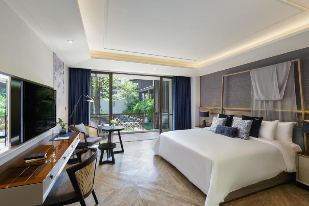 Postel nebo postele na pokoji v ubytování Maladee Rendezvous Hotel Chiang Mai