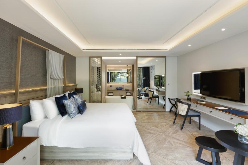 TV a/nebo společenská místnost v ubytování Maladee Rendezvous Hotel Chiang Mai