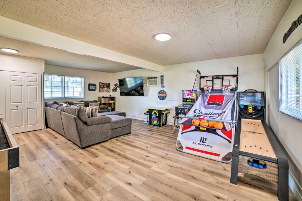 a living room with a game room with a video game system at Spacious Riverside Home with Game Room and Yard in Riverside
