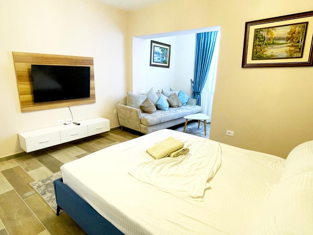 Katil atau katil-katil dalam bilik di Peace Apartments