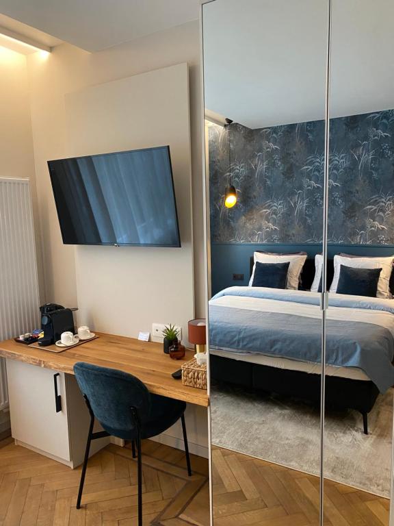 Postel nebo postele na pokoji v ubytování Good Mood - chambres et suite