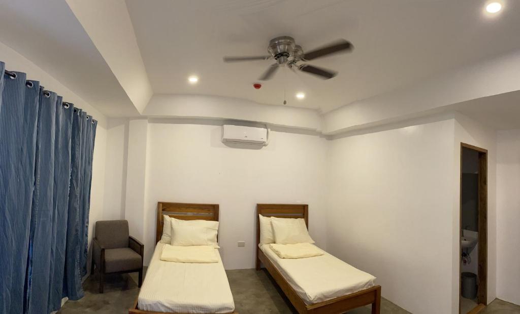 Postel nebo postele na pokoji v ubytování P&B Residences Legazpi