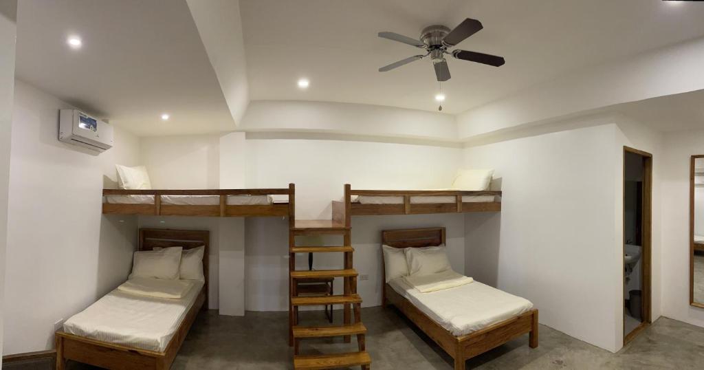 Postel nebo postele na pokoji v ubytování P&B Residences Legazpi