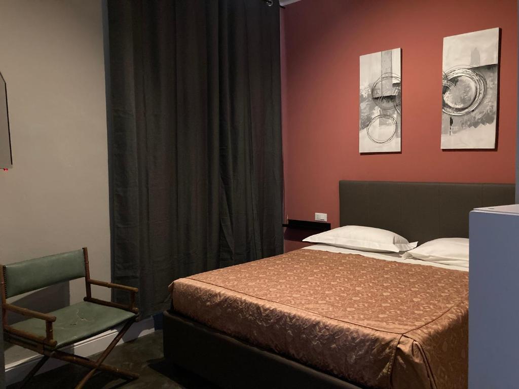 A bed or beds in a room at Hotel Calypso