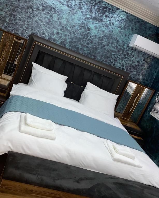 Postel nebo postele na pokoji v ubytování Hotel Premium