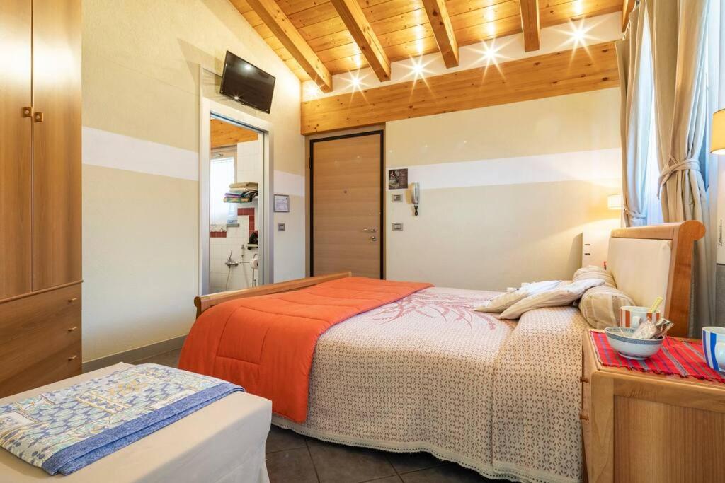 Postel nebo postele na pokoji v ubytování B&B Ambrosia