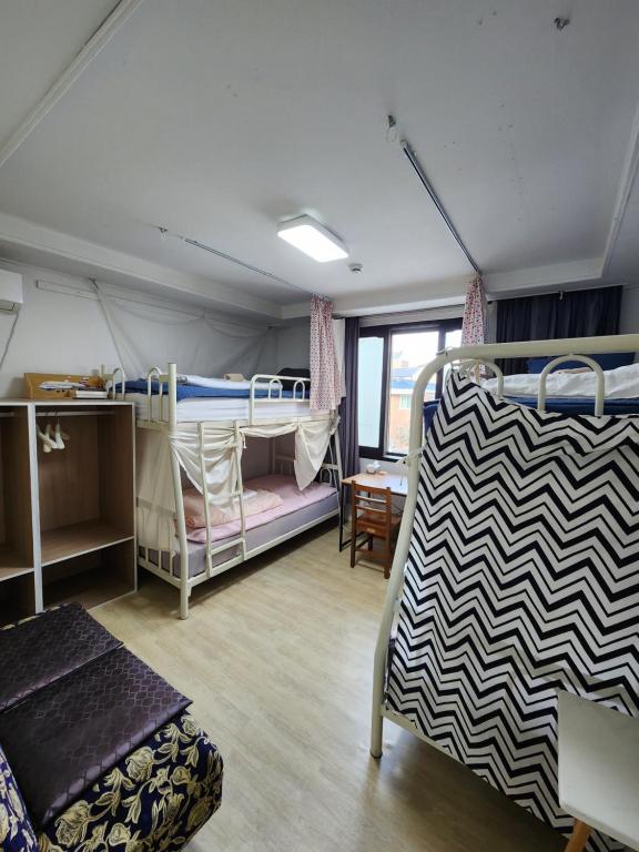 Postel nebo postele na pokoji v ubytování Aark House