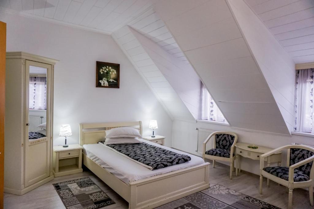 Postel nebo postele na pokoji v ubytování Hotel Claudiu