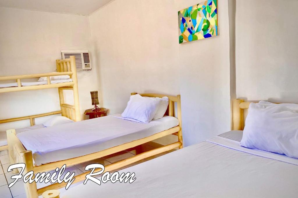 Postel nebo postele na pokoji v ubytování Bamboo Paraiso Resort at Bolo Beach