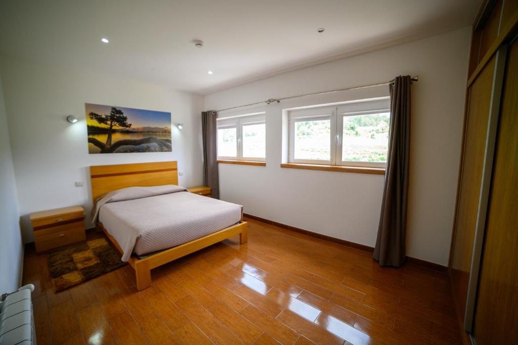 Postel nebo postele na pokoji v ubytování Funileiro, apartamentos e quartos