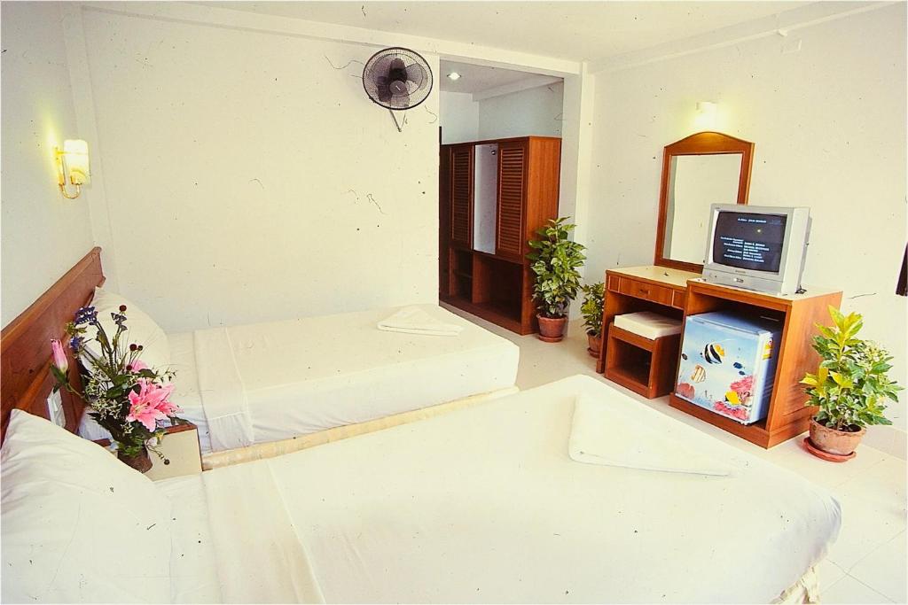Postel nebo postele na pokoji v ubytování J Mansion