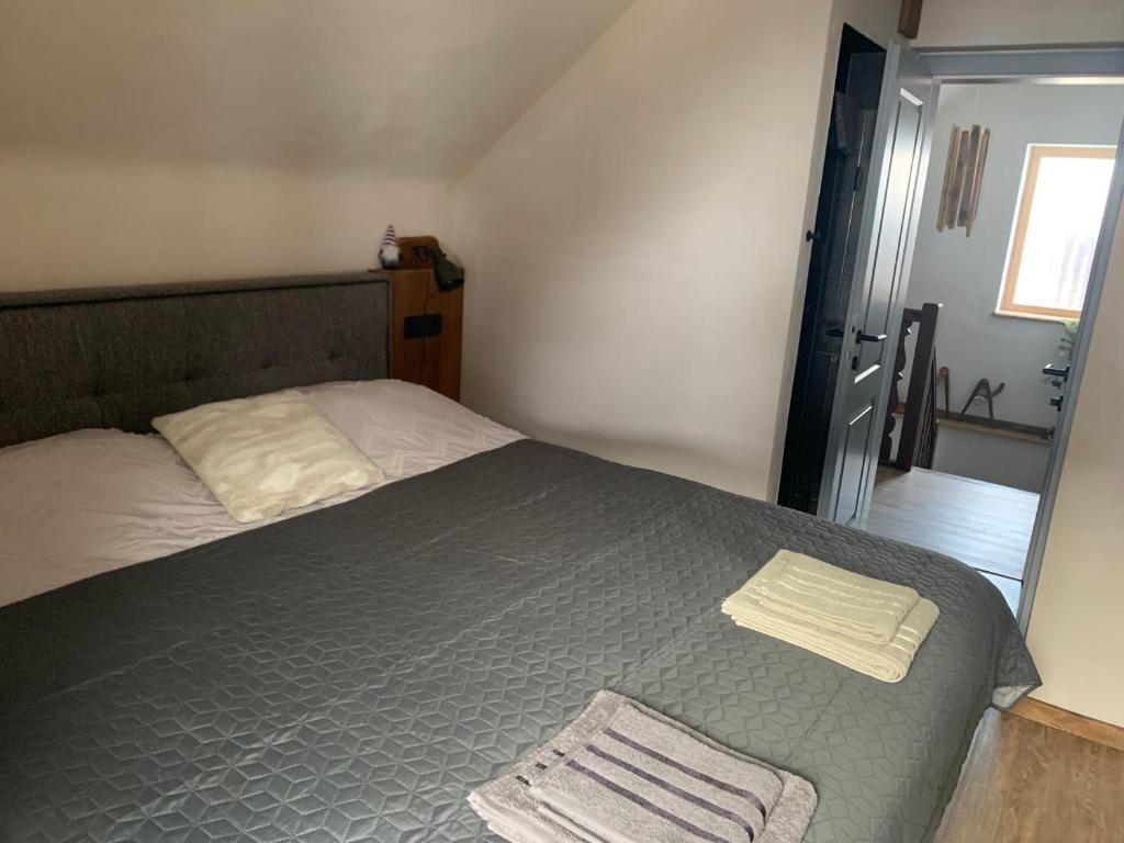 Postel nebo postele na pokoji v ubytování Hiša Pod gorami II****-house with wellness
