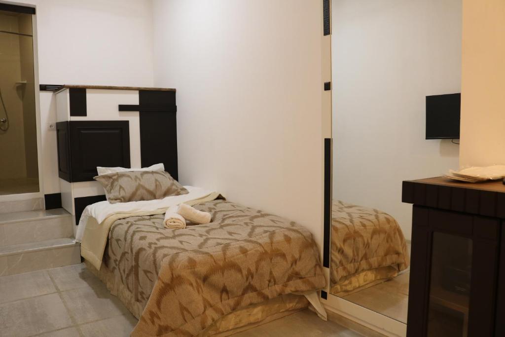 Postel nebo postele na pokoji v ubytování Kai Hotel Bar