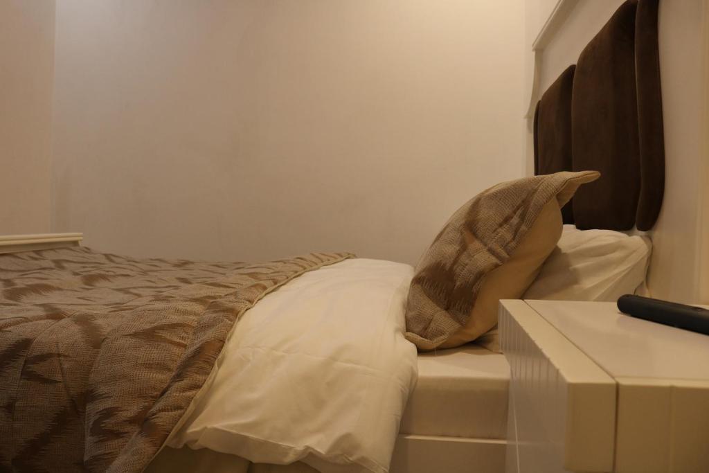 Postel nebo postele na pokoji v ubytování Kai Hotel Bar