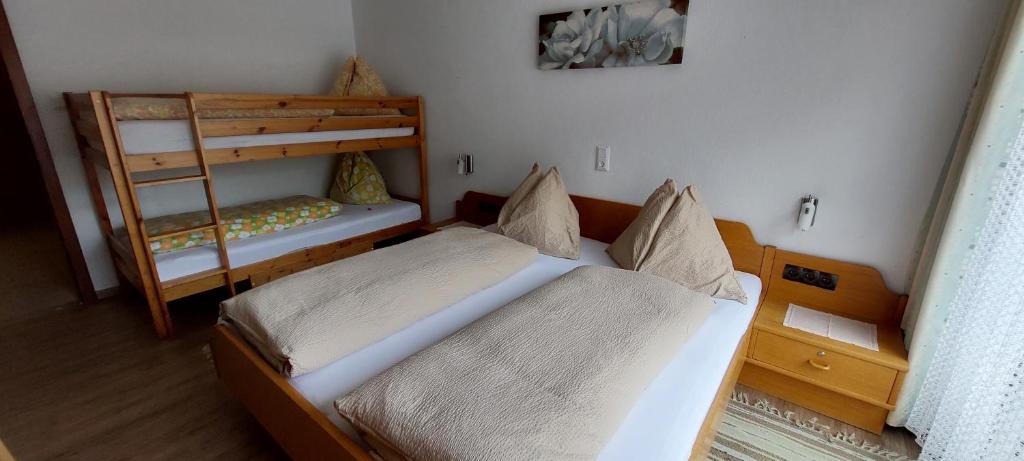 Postel nebo postele na pokoji v ubytování Pension Wildental