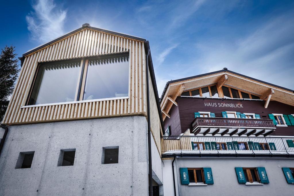 a building with a wooden roof on top of it at Chalet Sonnblick in Stuben am Arlberg