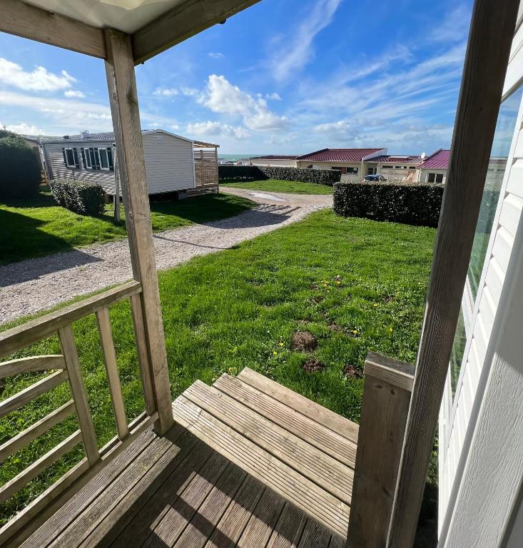 a view from the front porch of a house at GRAIN DE SABLE - Mobil Home - clim réversible - 5 pers - vue mer - Le Portel in Le Portel