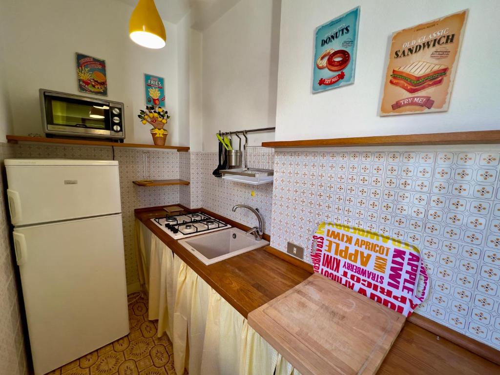 Kuchyň nebo kuchyňský kout v ubytování Appartamenti Via Roma 41