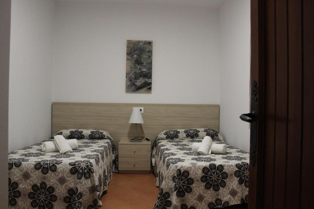 Postel nebo postele na pokoji v ubytování Villa Piscis