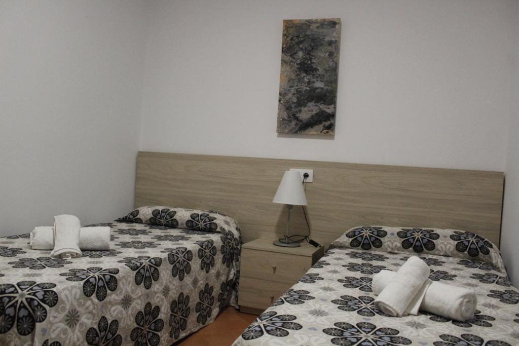 Postel nebo postele na pokoji v ubytování Villa Piscis