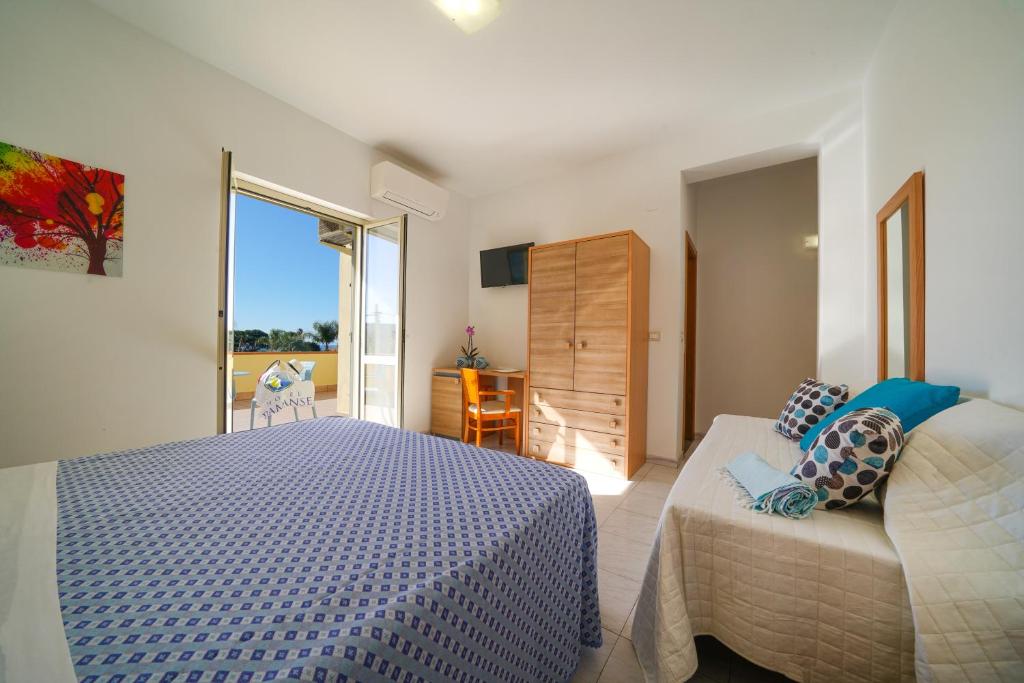 Postel nebo postele na pokoji v ubytování Hotel Damanse