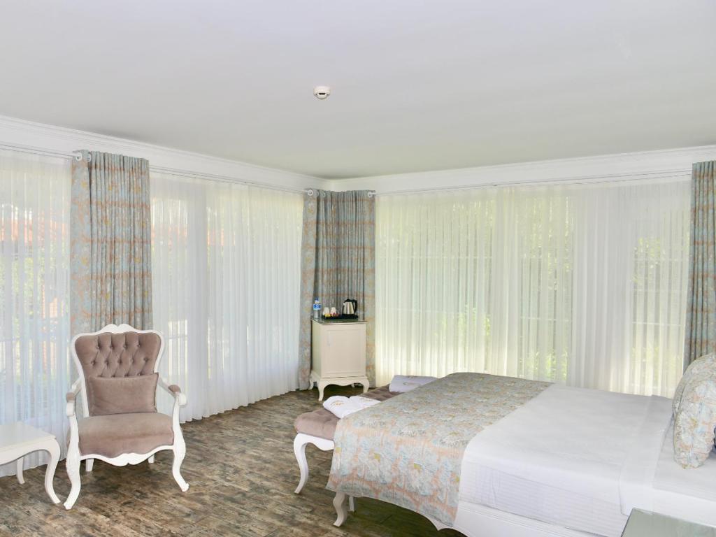 Postel nebo postele na pokoji v ubytování Göcek Naz Hotel