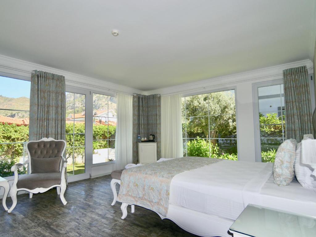 Postel nebo postele na pokoji v ubytování Göcek Naz Hotel