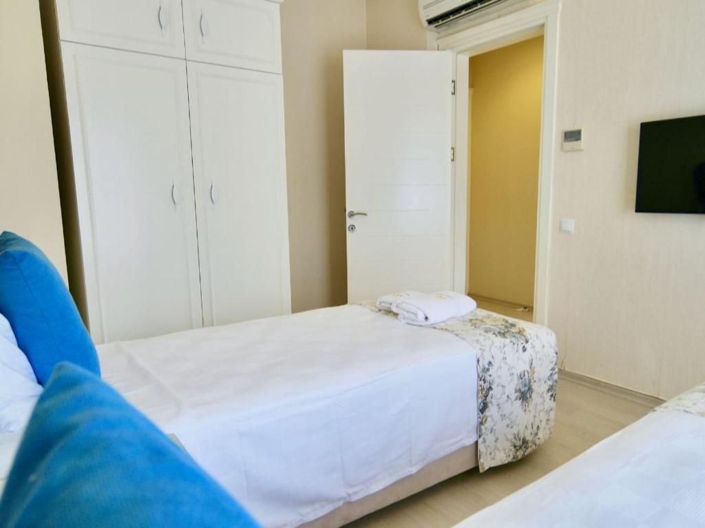 Postel nebo postele na pokoji v ubytování Göcek Naz Hotel