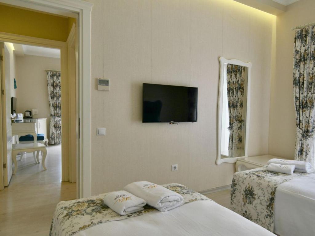 Postel nebo postele na pokoji v ubytování Göcek Naz Hotel