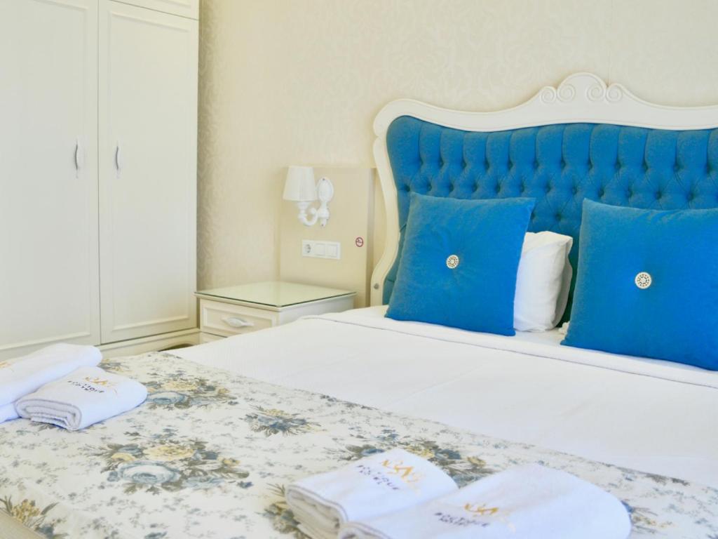 Postel nebo postele na pokoji v ubytování Göcek Naz Hotel
