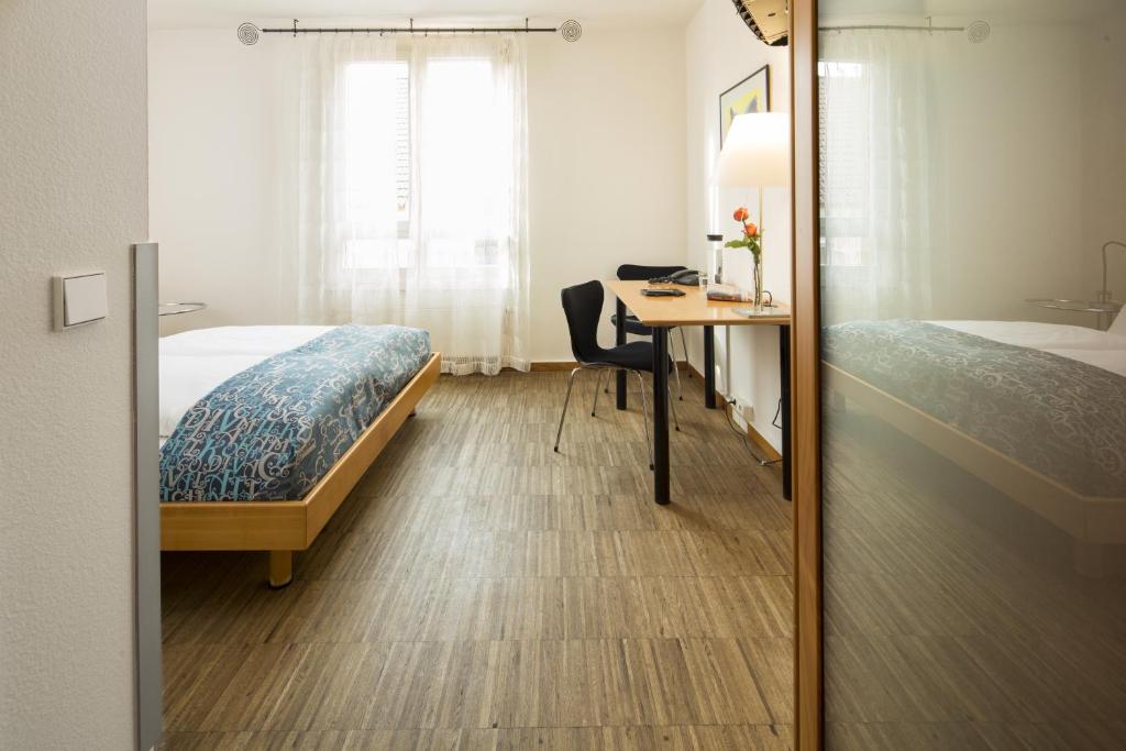 Postel nebo postele na pokoji v ubytování Business & Art Hotel Markgraf